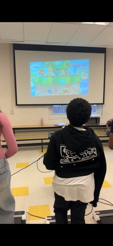 Students gaming on treadmills at Sojourner Truth Montessori