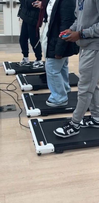 Walking treadmills lined up for exergaming session